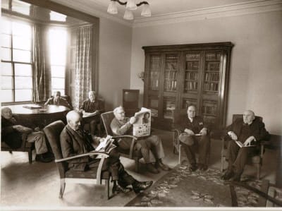 historic photo of William Simpsons residents in a sitting room at the home